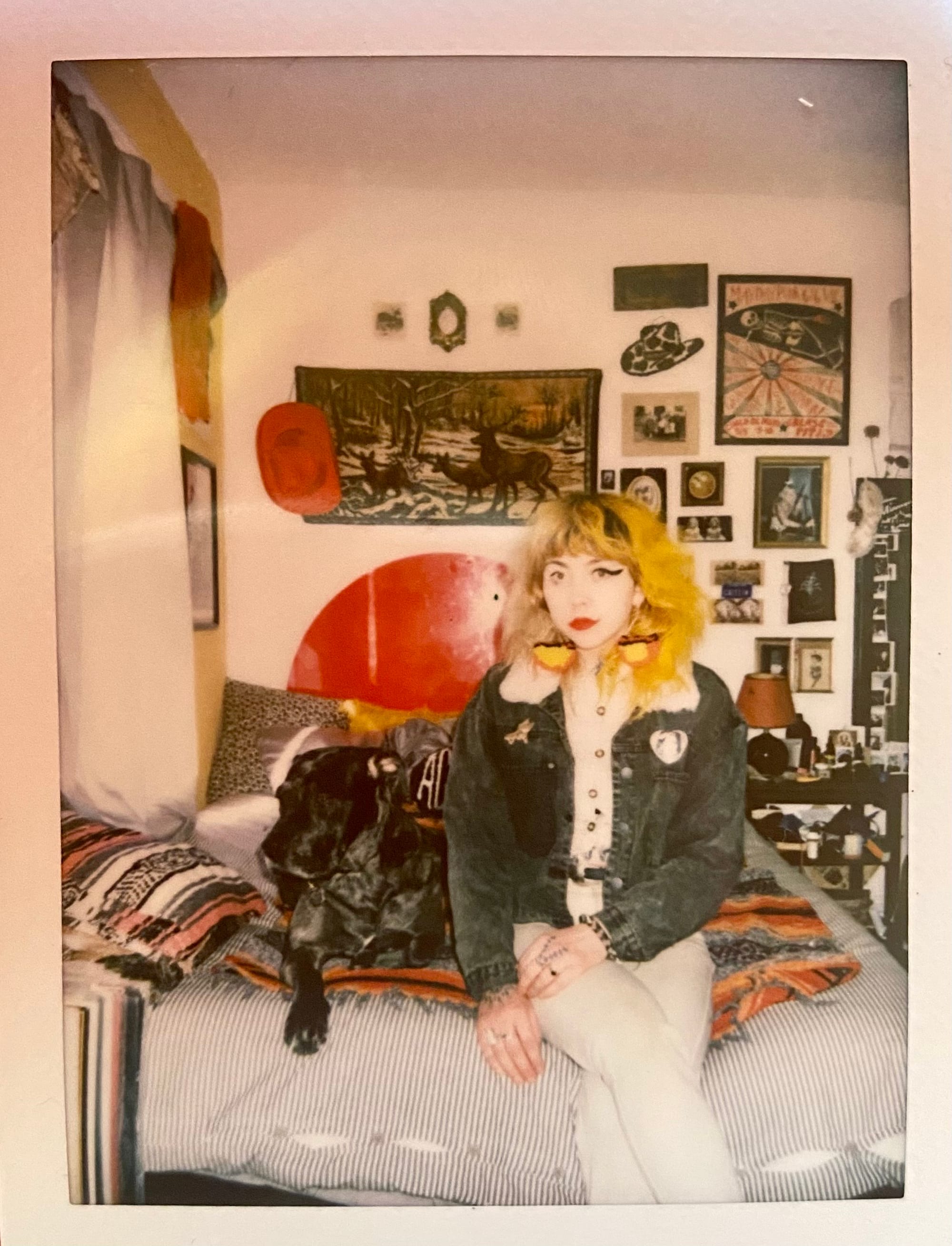 Caitlin Angelica with Oakley in her 2022 bedroom, courtesy the artist