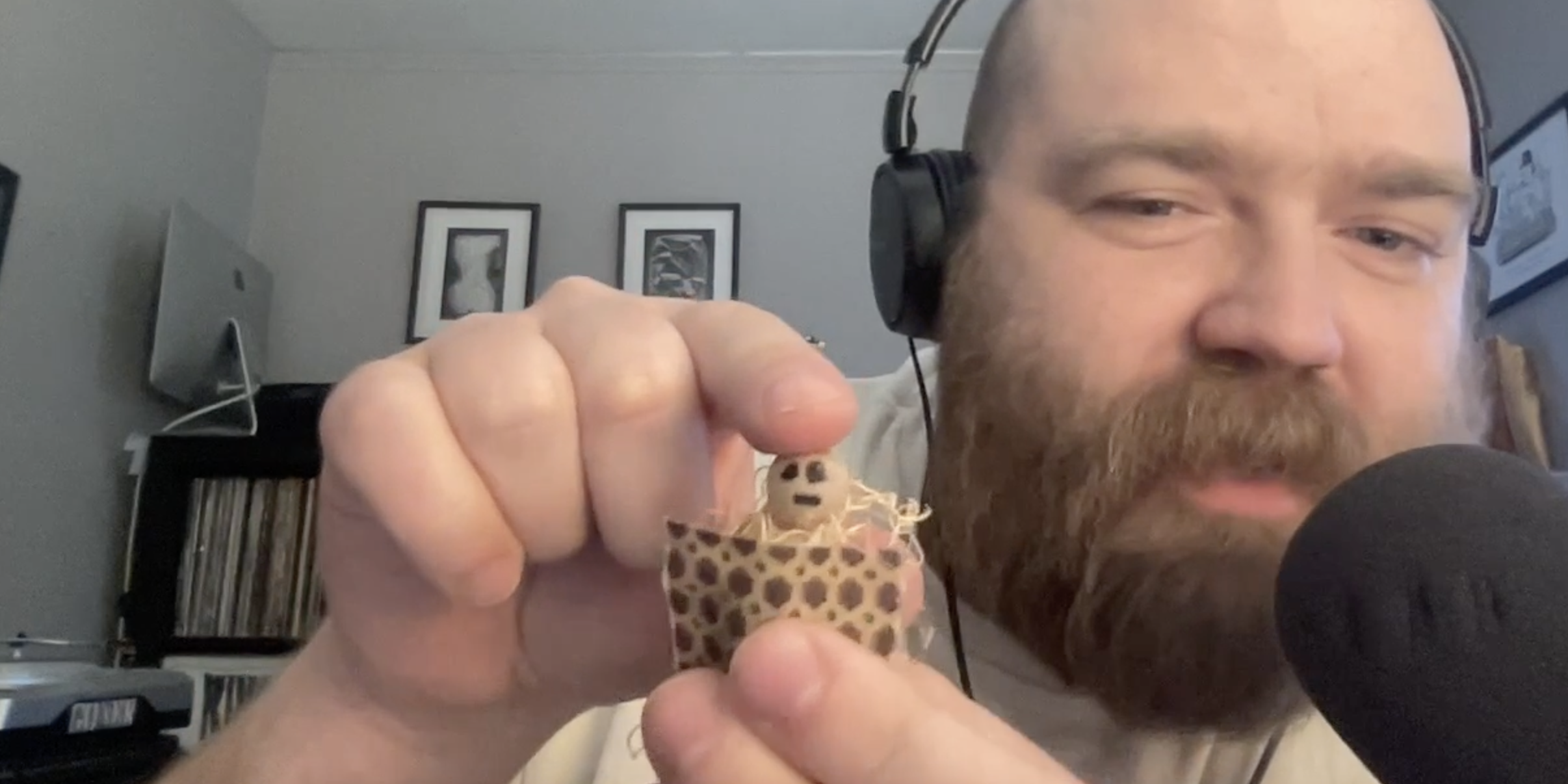 Evan Minsker showing Nina Corcoran the face of a haunting baby Jesus ornament, which he made in church as a small child, while recording Punk This Week episode 64Evan Minsker showing Nina Corcoran the face of a haunting baby Jesus ornament, which he made in church as a small child, while recording Punk This Week episode 64