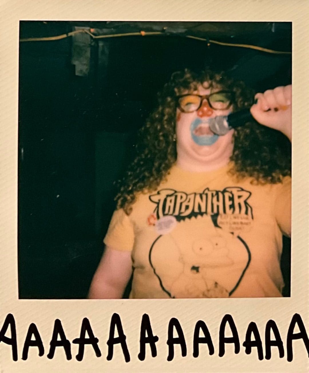 Big Clown’s Lucy performs at the Lost Cross punk house in Carbondale, Illinois; photo by Berget B